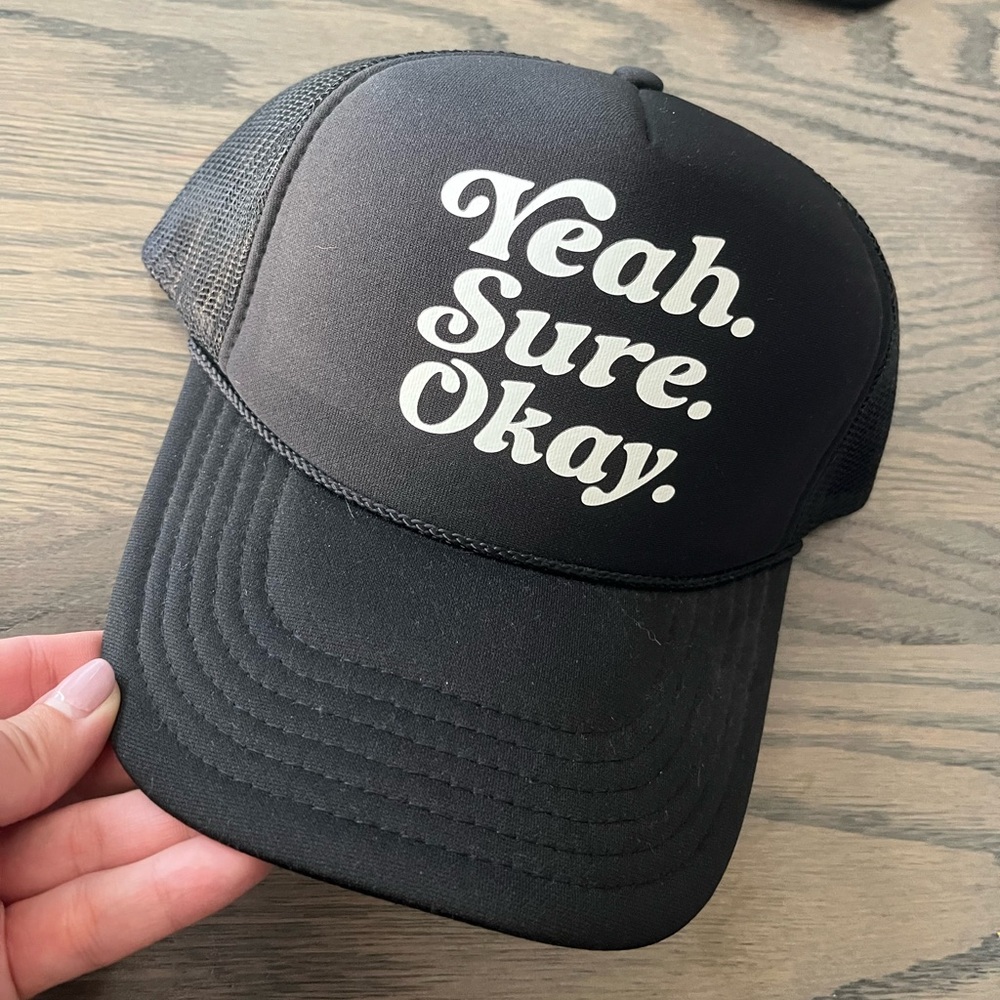 Yeah. Sure. Okay. Black Trucker Cap